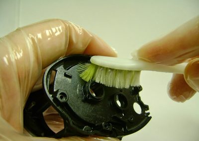 Scrubbing a reel frame clean