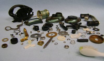 Reel parts laid out during a teardown
