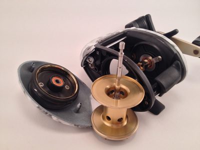 Baitcasting reel opened with the spool and side plate removed